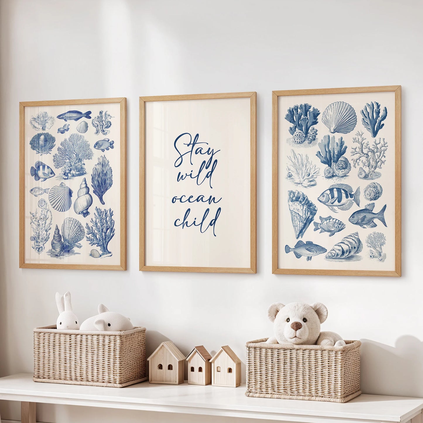 Thin wood-framed sea life illustration set of three large wall prints keeps a kids playroom neat and lively above toy storage.