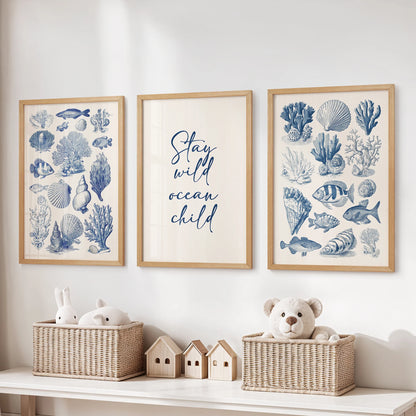 Thin wood-framed sea life illustration set of three large wall prints keeps a kids playroom neat and lively above toy storage.