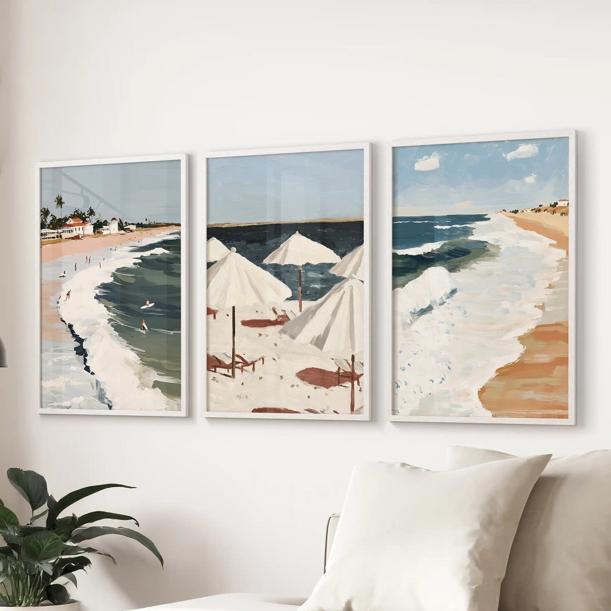 Seascape horizon artwork, 3-piece set, pairs slim white frames with coastal tones to span a sitting room wall over the sectional.