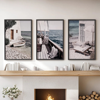 Coastal harbor views three-print poster set in black frames, giving the lounge a clean nautical line over the fireplace for balanced, airy appeal.