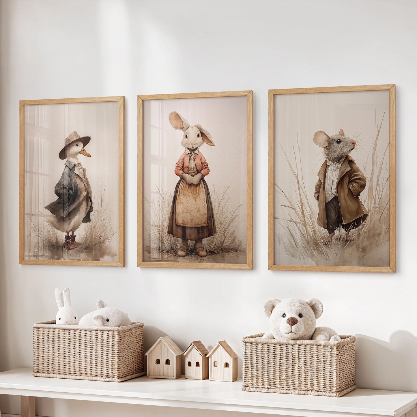 Cottagecore farm animal prints, a three-piece wall-hanging set in natural oak frames, sit above the playroom storage bench for warm, seasonal charm.