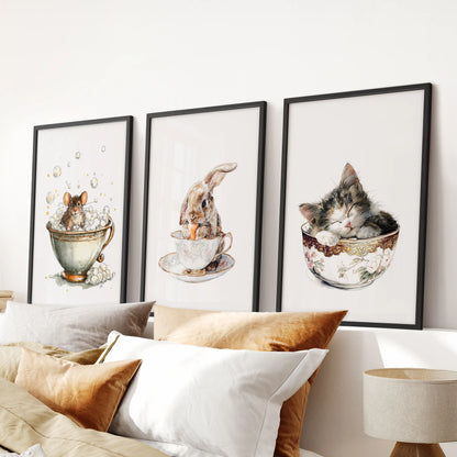 Above the bed’s headboard, a 3-piece black-framed wall decor of a sleepy kitty in a cup lends the bedroom a mild vintage watercolor feel.