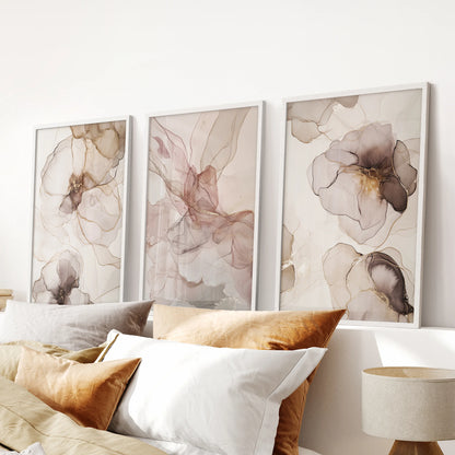 Soft-tone watercolor shapes in a 3 piece wall decor with white frames lend a minimalist touch to the bedroom above the headboard.