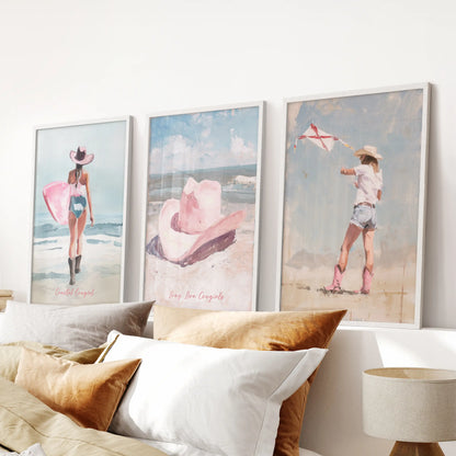This soft surfer girl trio in white frames hangs over the bed headboard, filling the bedroom with blush motion and breezy, easy charm.