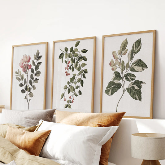 French country botanicals, a wall art trio in natural oak frames, grace the space over the bed headboard and lend a restful note to the bedroom.