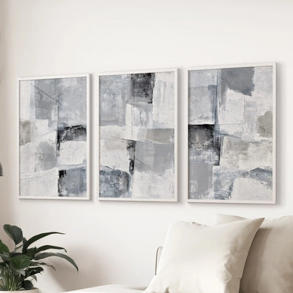 Japandi neutral forms trio of wall art prints floats over the couch in the sitting room, their soft geometry trimmed in white frames for calm balance.
