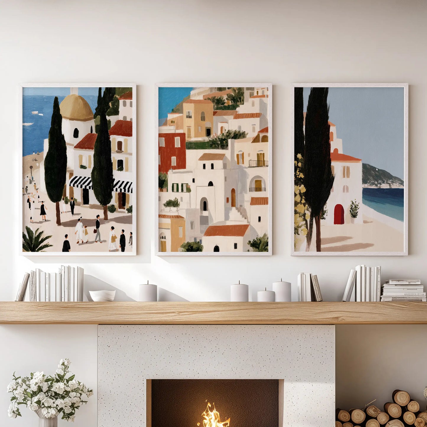 Mediterranean coast landscapes, three-piece wall art set in white-framed prints, sit in the lounge above the fireplace with breezy, sunlit balance.