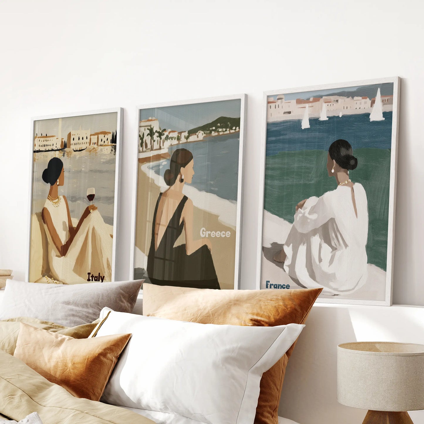 Elegant female figures set of 3 wall decor arrives over the bedroom headboard in clean white frames, adding a chic, beach-to-boulevard attitude.