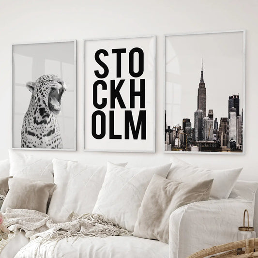 Set of 3 wall posters featuring leopard art, Stockholm text design, and New York architecture in black and white minimalist style. White frames for living room.
