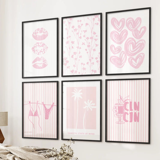Pastel pink beach prints six-piece wall art set in slim black frames, styled near the bed wall to bring a soft coastal vibe to a modern bedroom.