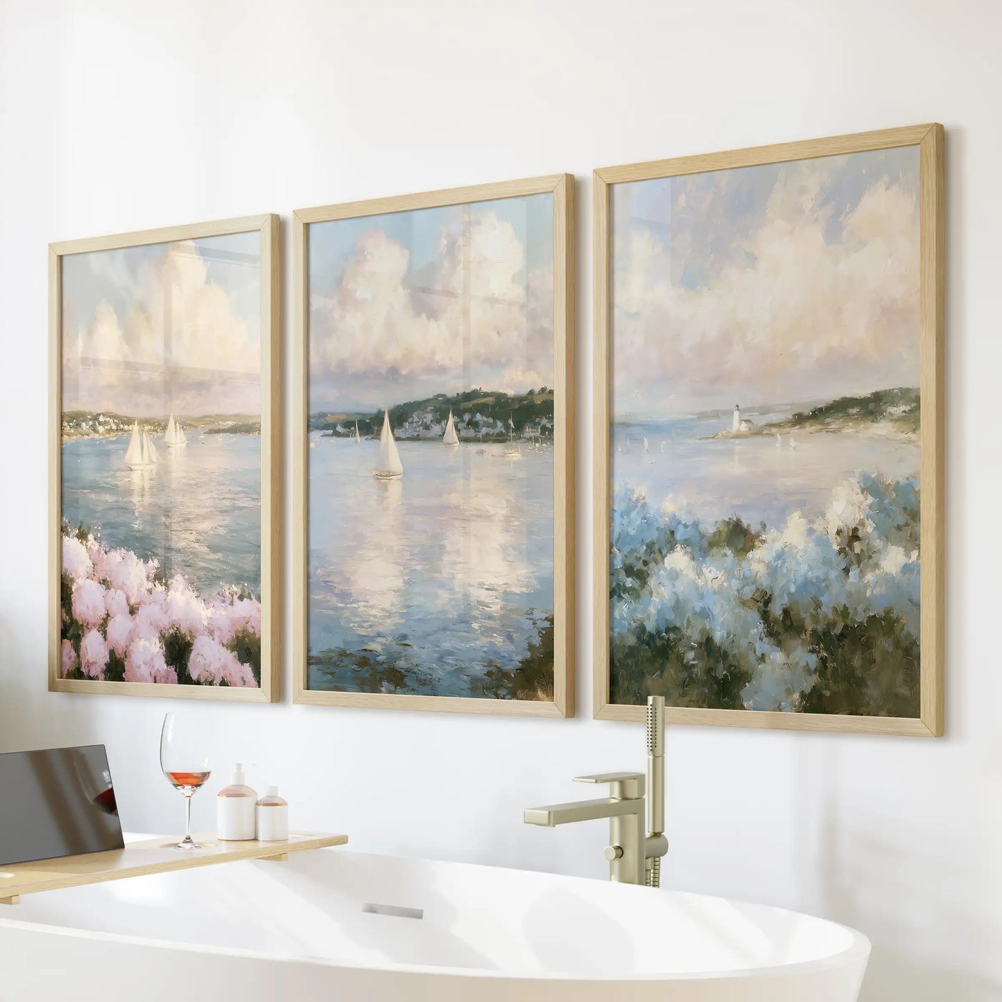 Wood-framed wall art in a 3 pc ocean and sky seascape set hangs above the bathroom freestanding tub. A wide horizon and quiet surf complete the view.