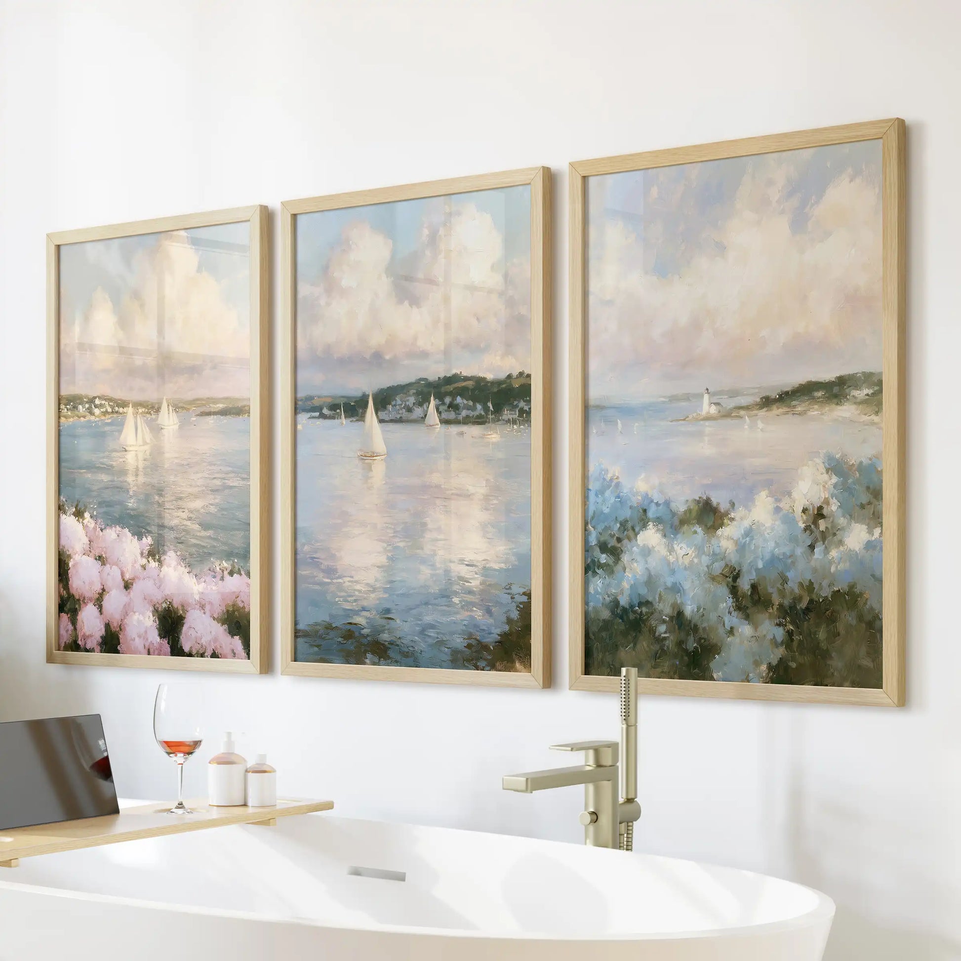 Wood-framed wall art in a 3 pc ocean and sky seascape set hangs above the bathroom freestanding tub. A wide horizon and quiet surf complete the view.