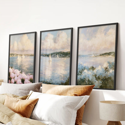 New England coastal cottage 3-piece wall art set crowns the bedroom headboard, the trio in a slim black frame finish for relaxed summer-house calm.