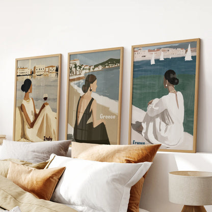 A light-oak framed art set of three hangs over the bed, infusing the bedroom with the warmth of sunlit stucco and sailing-day calm.