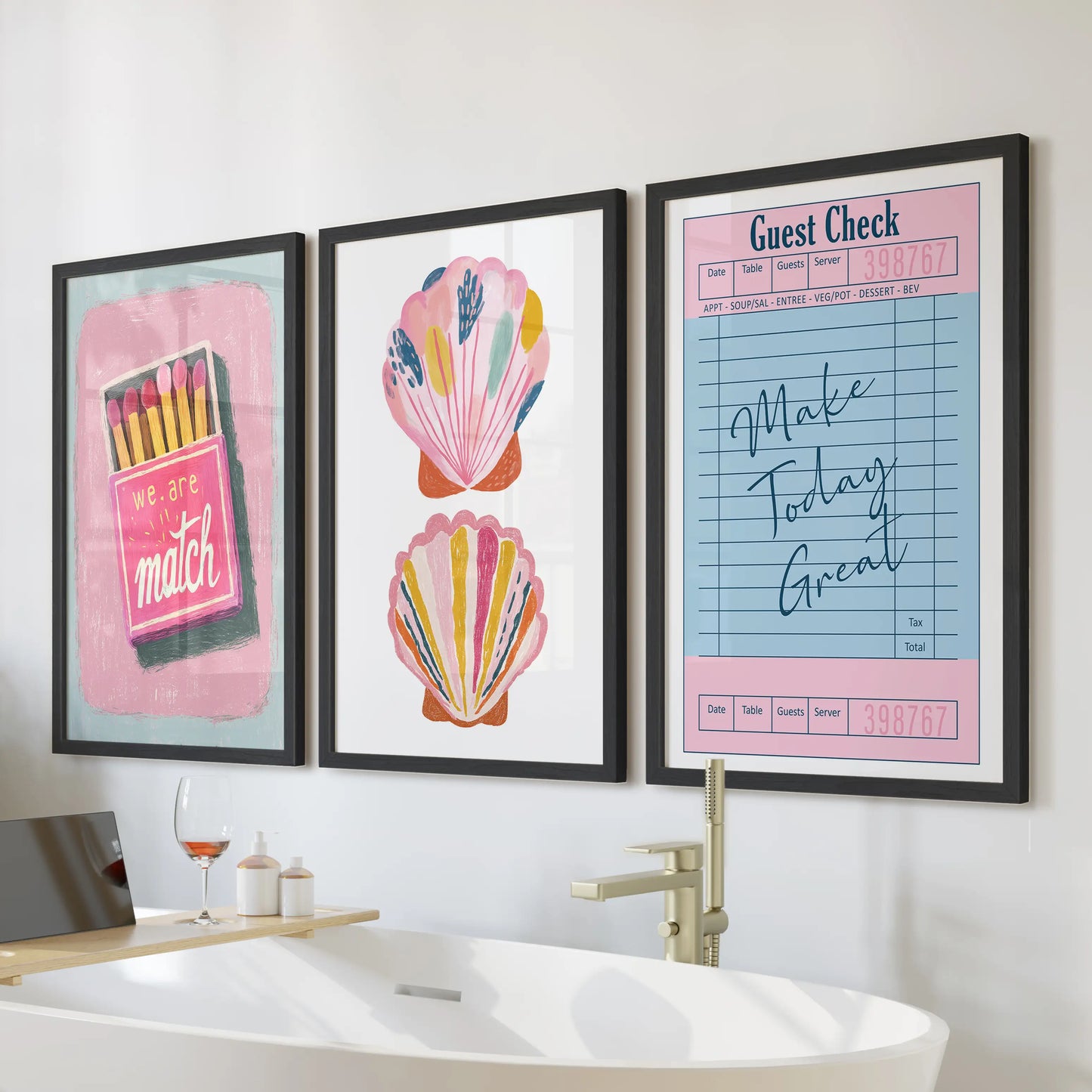 Print set of three coastal beachy wall art for the bathroom in black frames, arranged over the tub for a bright, preppy splash.