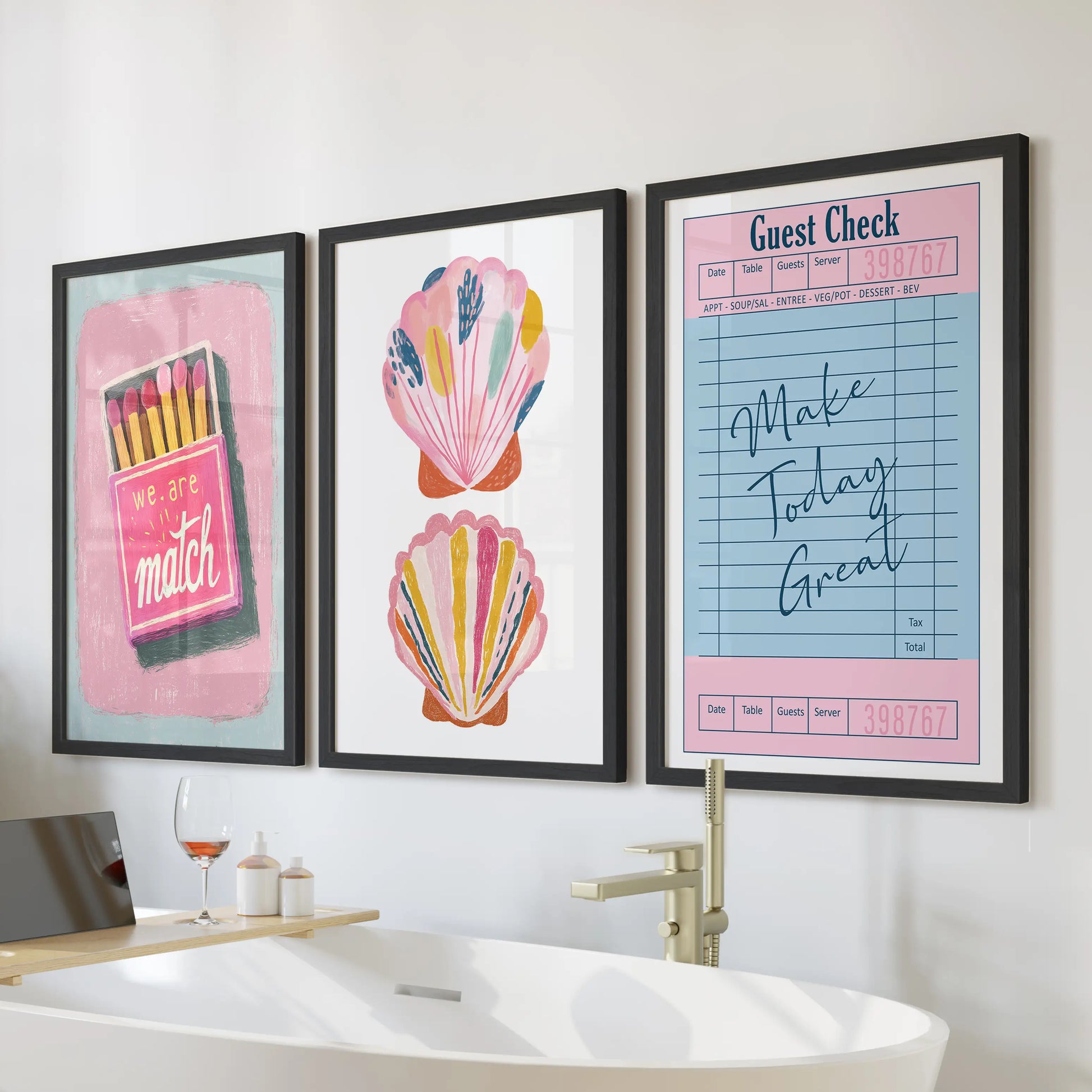 Print set of three coastal beachy wall art for the bathroom in black frames, arranged over the tub for a bright, preppy splash.