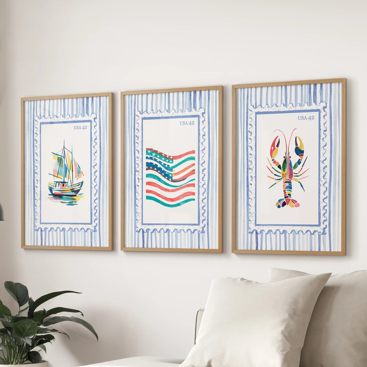 Beach stamp illustrations in a 3-piece wall art set, light wood framed and hung above the sectional to bring bright seaside energy to the family room.