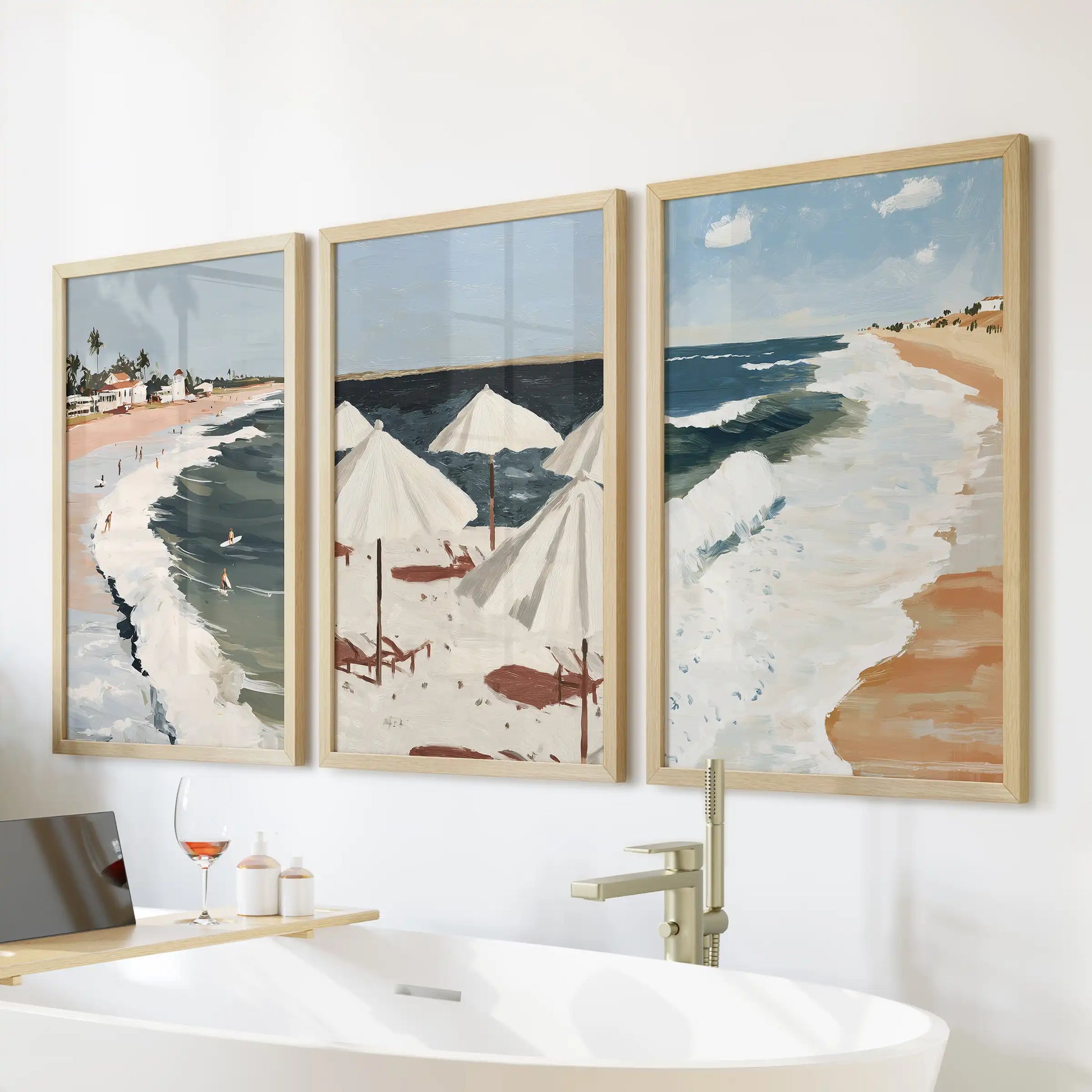 Surf coast shoreline wall decor, three-piece set, comes in warm wood frames to freshen a bathroom, aligned neatly above the bathtub.