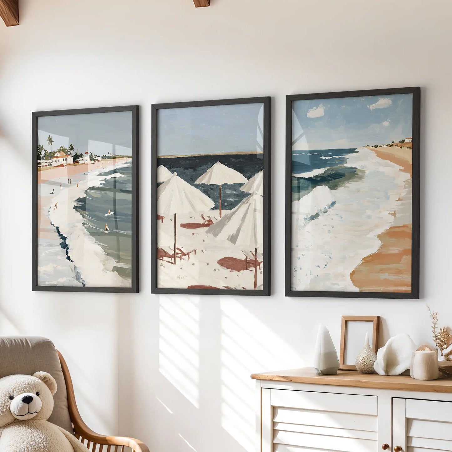 Beach umbrellas art prints, three-print set, add a sunlit pop in black frames to a children’s room, styled as wall art above the dresser.