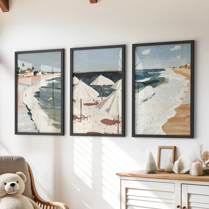 Beach umbrellas art prints, three-print set, add a sunlit pop in black frames to a children’s room, styled as wall art above the dresser.