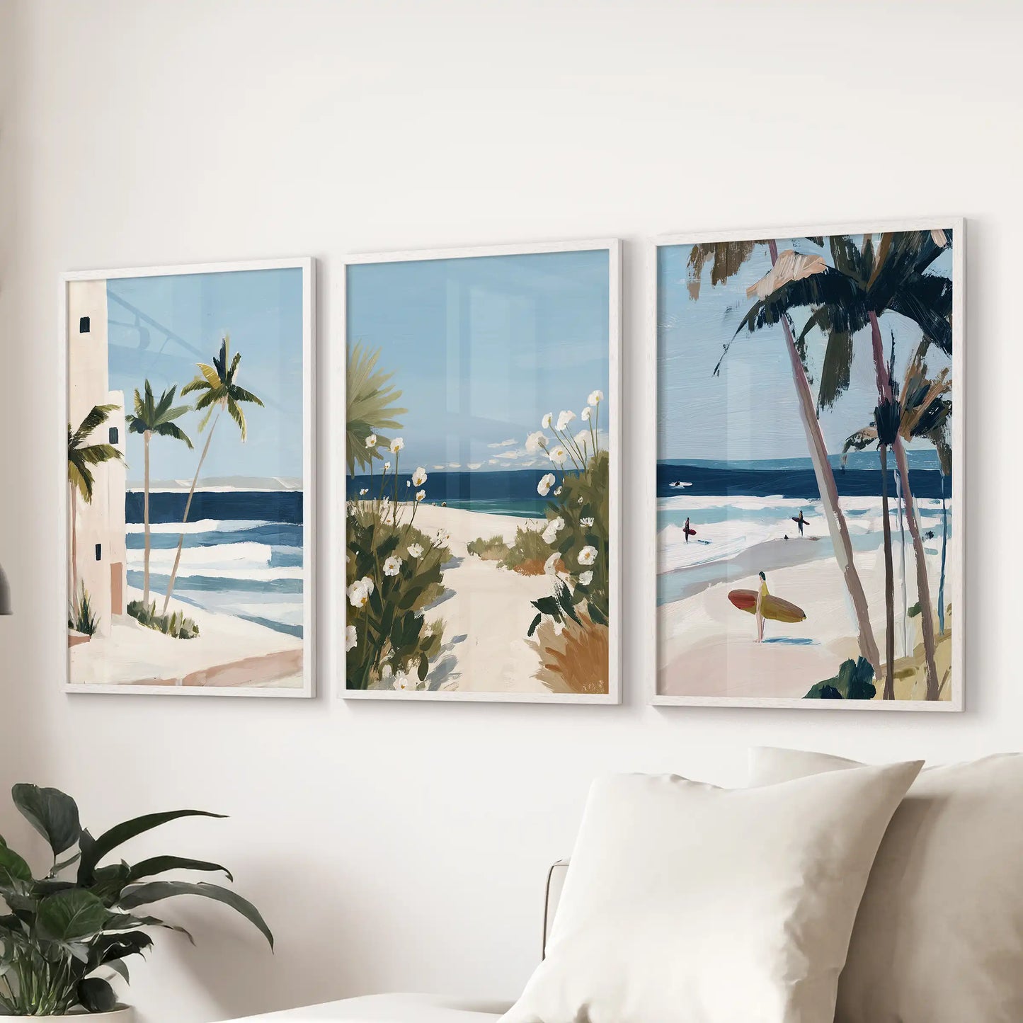 Coastal dune pathway wall art, 3-piece set in white frames, stretches above the sectional sofa to add breezy texture and light to the living room.