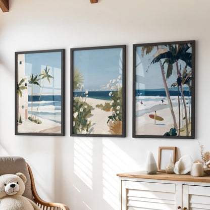 Surf waves framed prints, a set of three in black frames, create a calm coastal moment above the dresser in a kids room while keeping the palette airy.