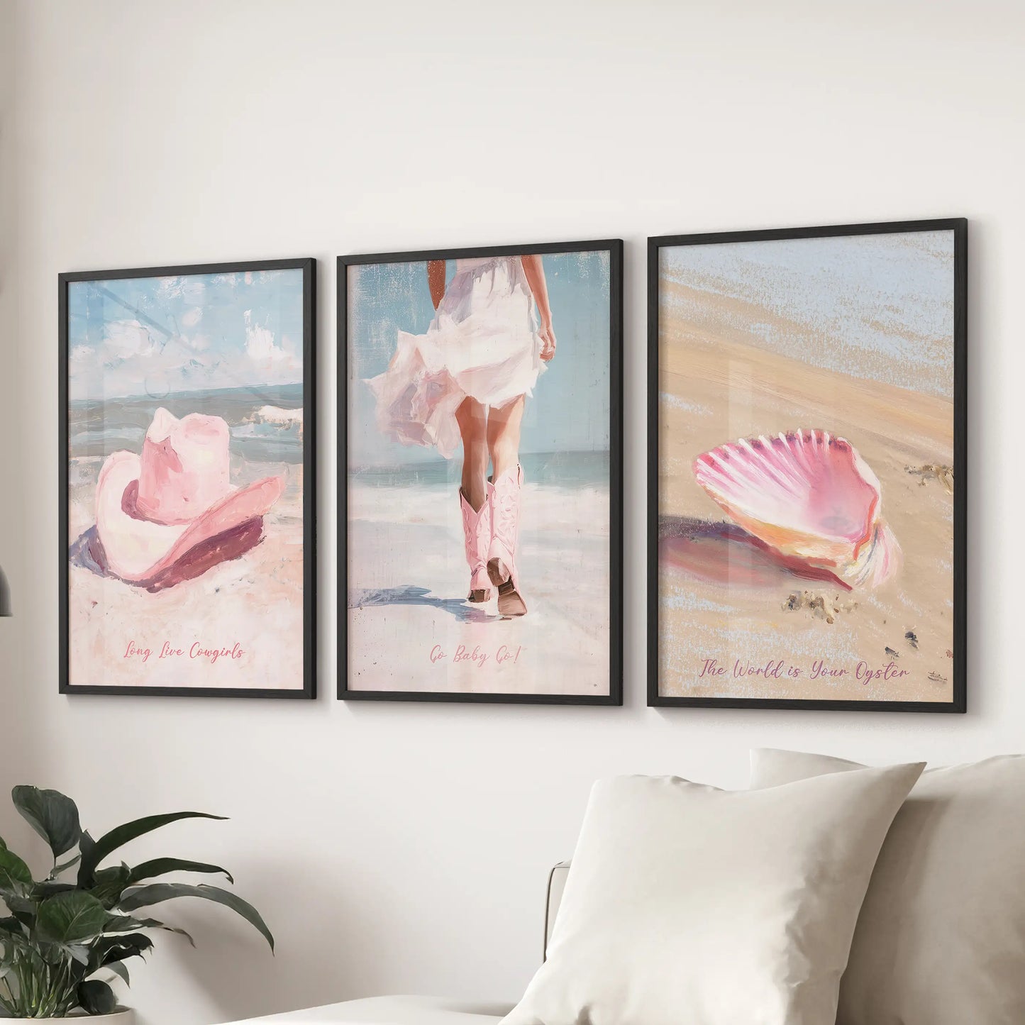 Three black-framed art prints of western boots hang above the lounge sectional, their dusty pink tones giving the space an easy coastal mood.