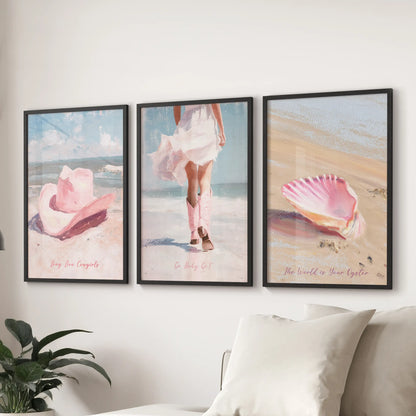 Three black-framed art prints of western boots hang above the lounge sectional, their dusty pink tones giving the space an easy coastal mood.