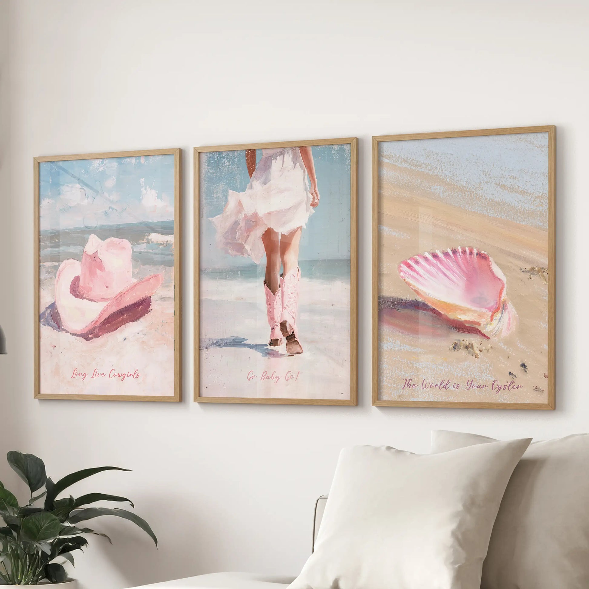 Three wood-framed wall artworks in a summer western style hang above the sectional, tying warm desert hues to an airy coastal feel.