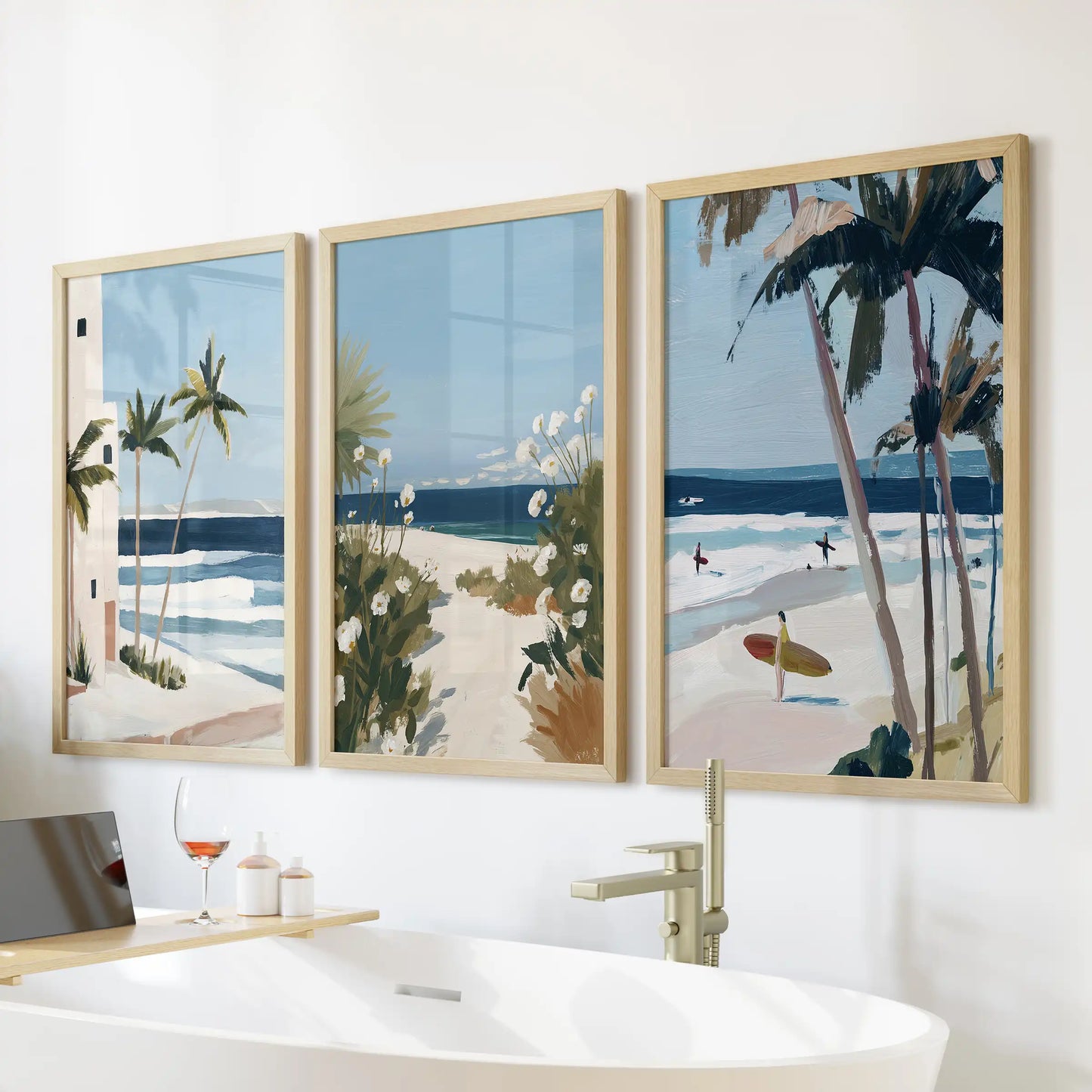 Tropical beach wall decor, gallery set of three with warm oak frames, relaxes the eye over the bath while echoing soft sand tones in the bathroom.