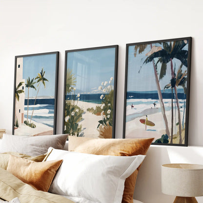 Ocean shoreline wall decor, three-print set in black frames, anchors the area above the bed headboard with soft sand hues and pale sea blues.