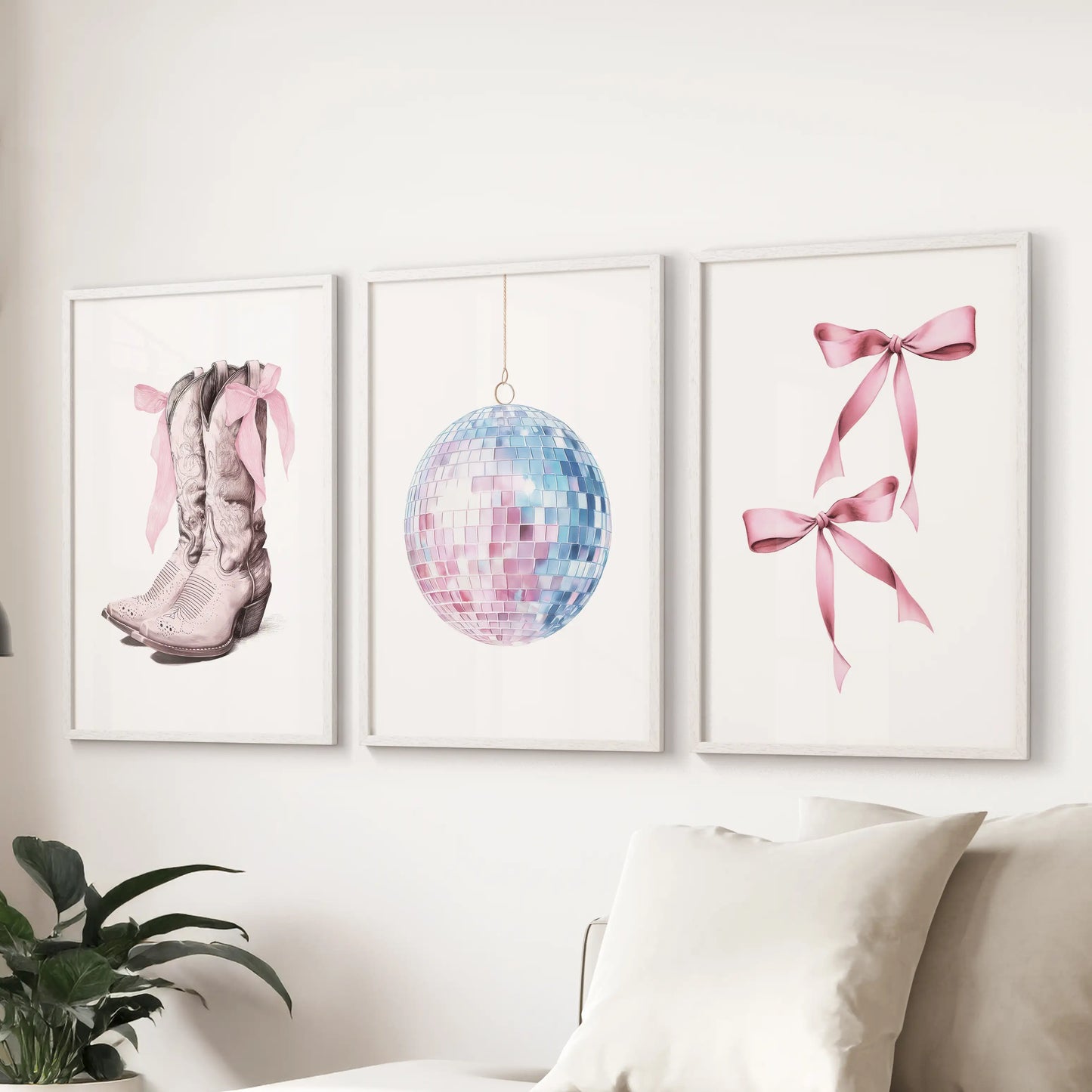 Coastal cowgirl motif wall art set of three, in fresh white frames, anchors the living room behind the sofa with playful pink-and-blue polish.