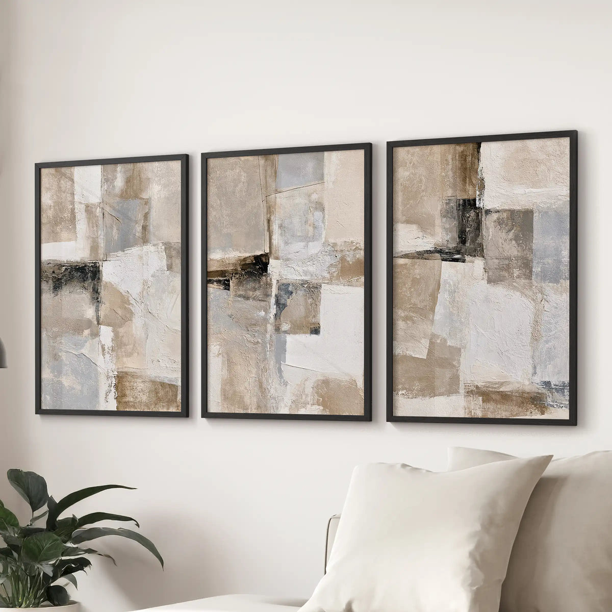 Scandinavian beige prints, a 3-piece wall art set, creates a calm focal point over the couch in the sitting room with slim black frames.
