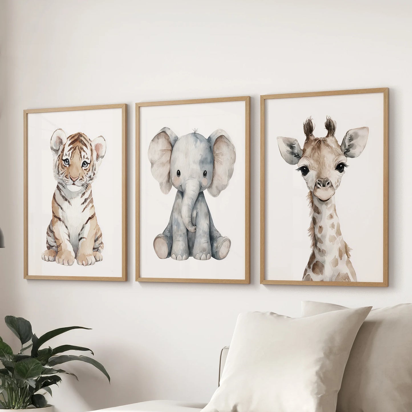 Nursery gallery wall featuring cute tiger, elephant and giraffe portraits. Thinwood frames for living room.