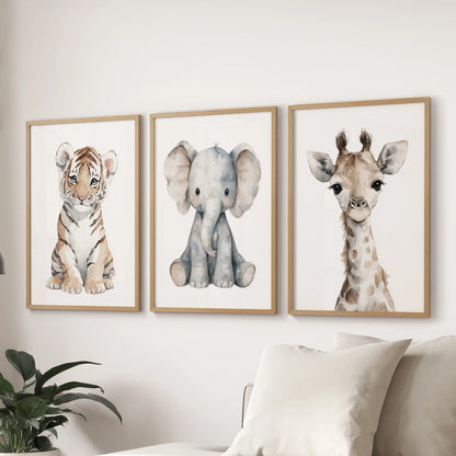 Nursery gallery wall featuring cute tiger, elephant and giraffe portraits. Thinwood frames for living room.