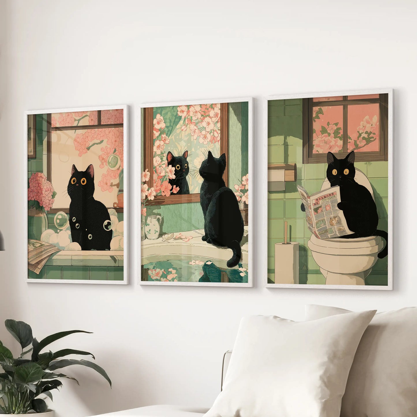 Cheeky black cat bathroom scene, set of three white-framed wall prints, enlivens the lounge and sits smartly over the sofa.