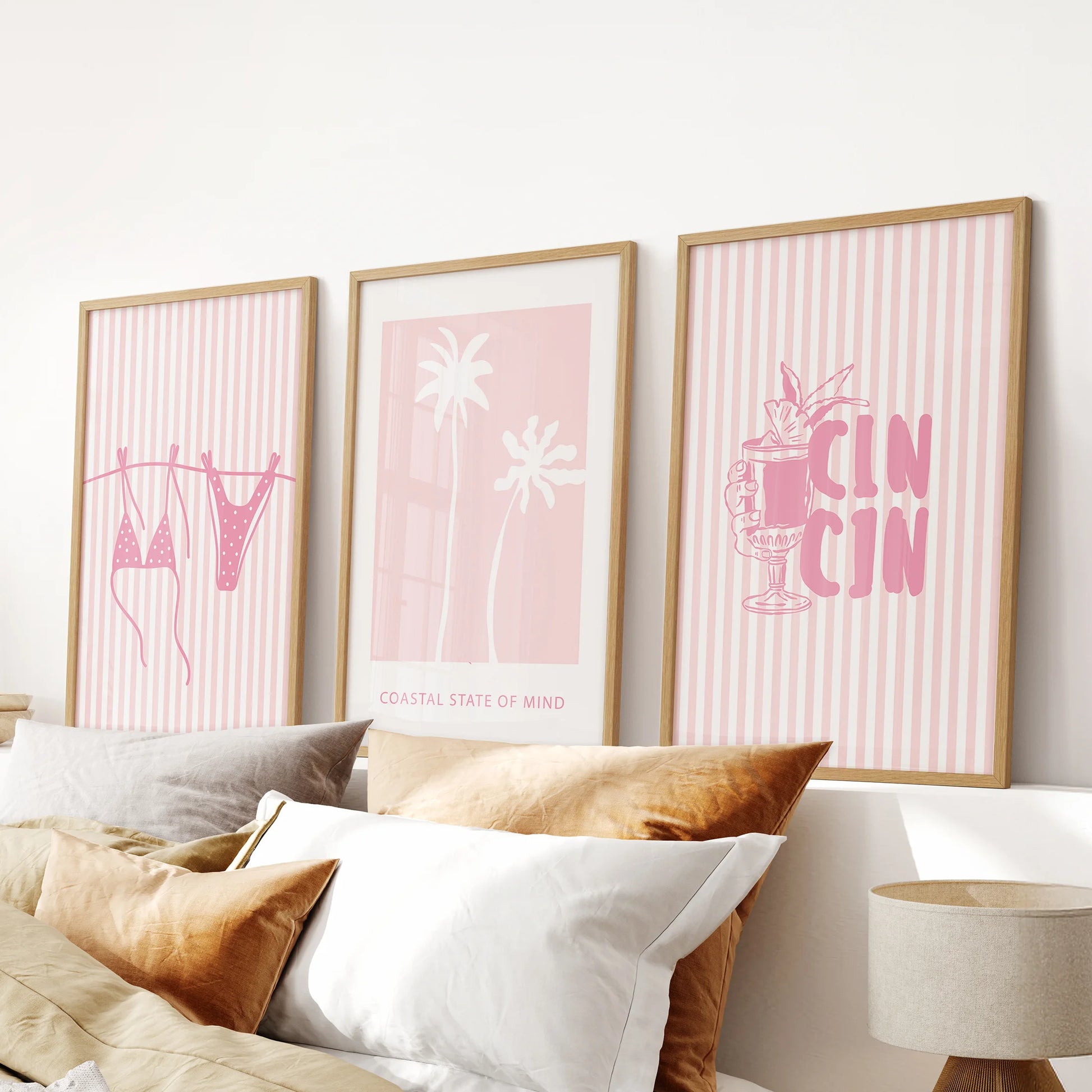 Cocktail poster wall decor, a 3-panel set with natural wood frames, hangs above the bed to layer warm, beach-meets-west charm in the bedroom.