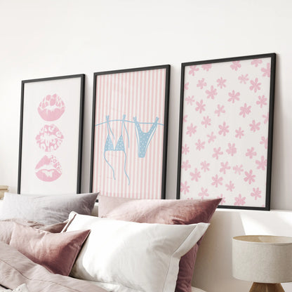 Modern black-framed prints with coquette beach photos form a 3-print wall set that softens the pink bedroom above the bed.
