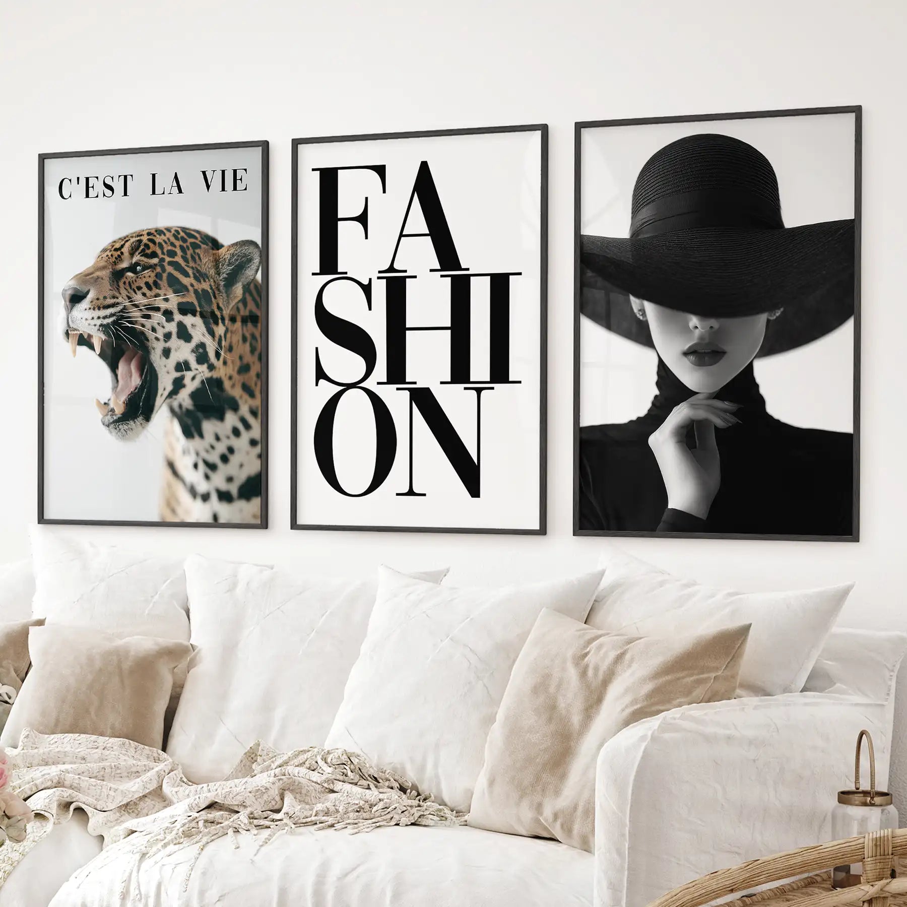 Chic leopard and fashion wall art set in neutral black and white tones. Black frames over the couch.