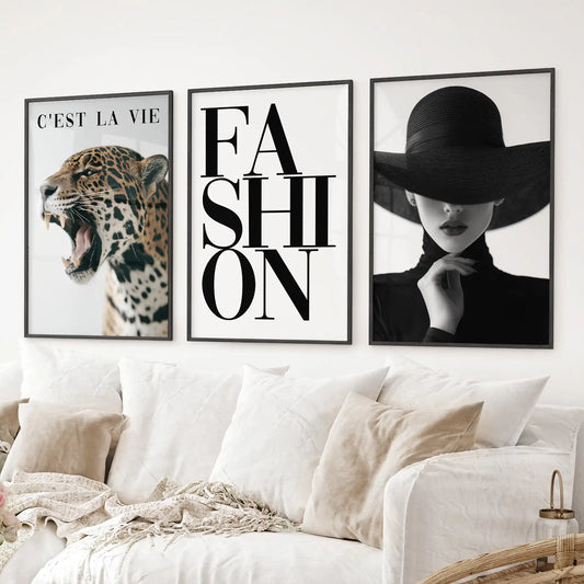 Chic leopard and fashion wall art set in neutral black and white tones. Black frames over the couch.