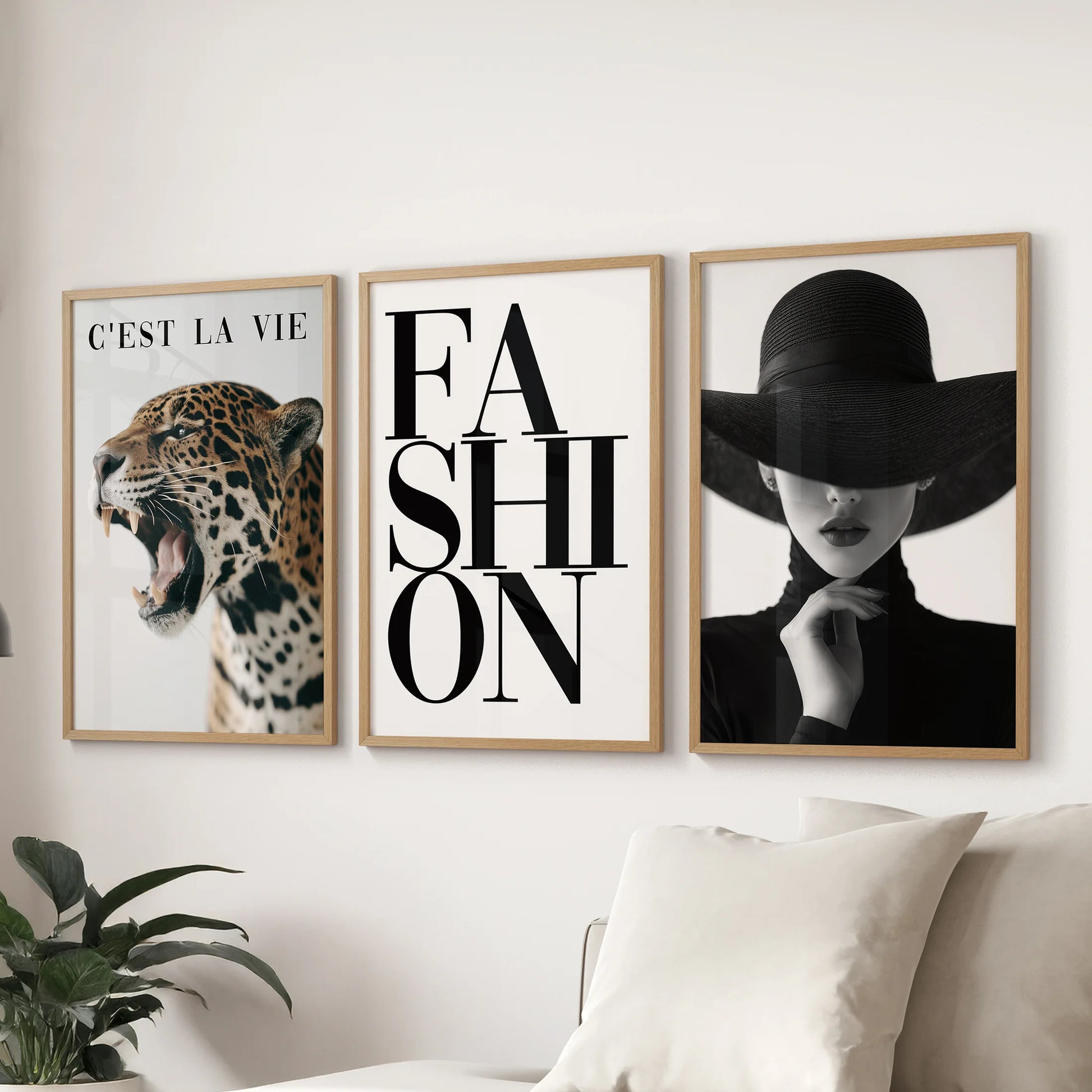 Fashion illustration wall art set of three posters in light oak frames, showcased above the sectional sofa to refine the living room.