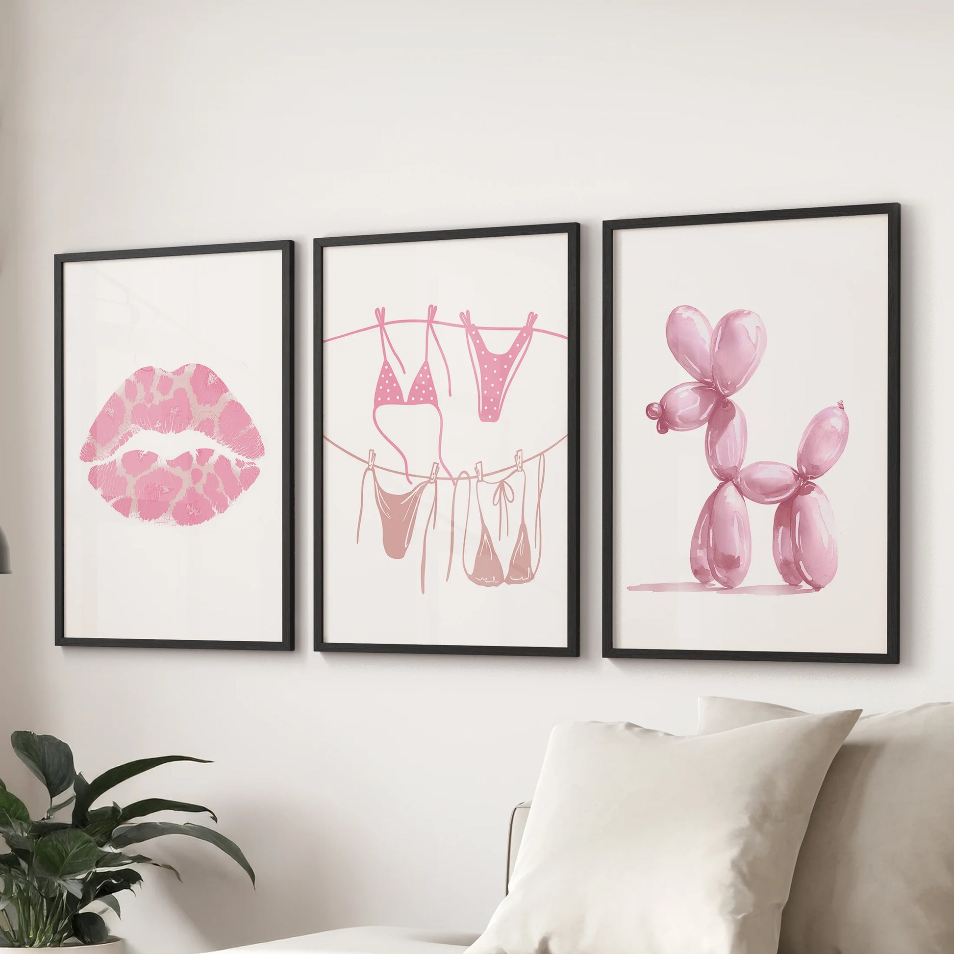 A playful trio of balloon dog wall prints in sleek black frames adds charm to the sitting room, styled together above the sectional sofa.