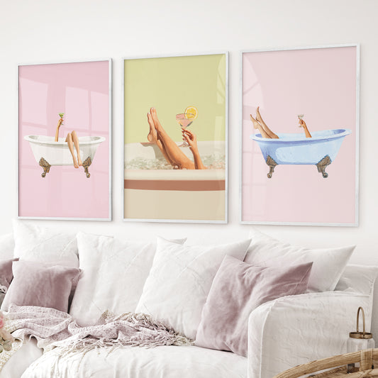 Fun pastel wall art with bathtub and drink illustration set. White frames above the sofa.