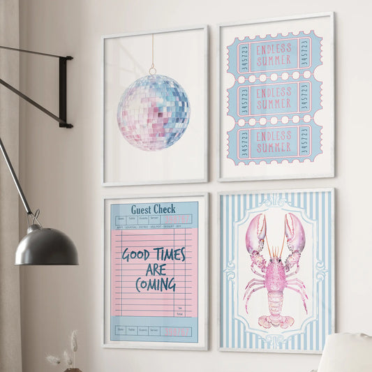 Four pink lobster art prints framed in crisp white hang over the couch, giving the family room a light coastal pop without crowding the space.