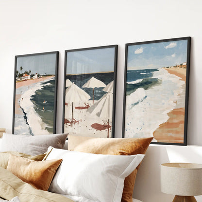 Framed in sleek black, this three-piece palm-lined beach triptych centers the bedroom wall above the headboard with a relaxed coastal mood.