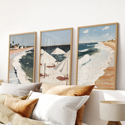 Beach umbrellas gallery set of three, in natural wood frames, brings a sunny accent to the bedroom when arranged as wall art above the headboard.