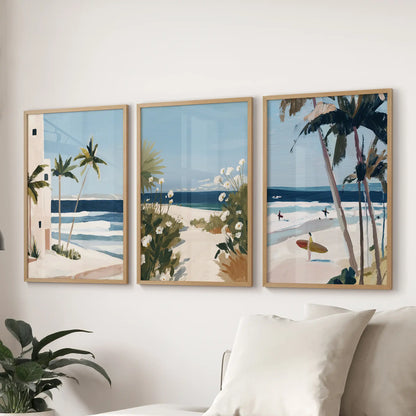 Surf waves gallery prints, a trio in oak wood frames, settle over the lounge sofa with motion and mist for a cool, coastal finish.
