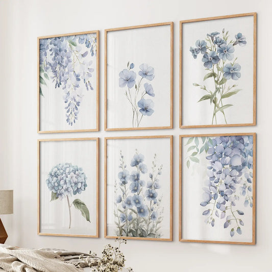 Set of 6 blue watercolor floral art prints with wisteria, flax, and hydrangea. Botanical modern wall decor. Thinwood frames over the bed.