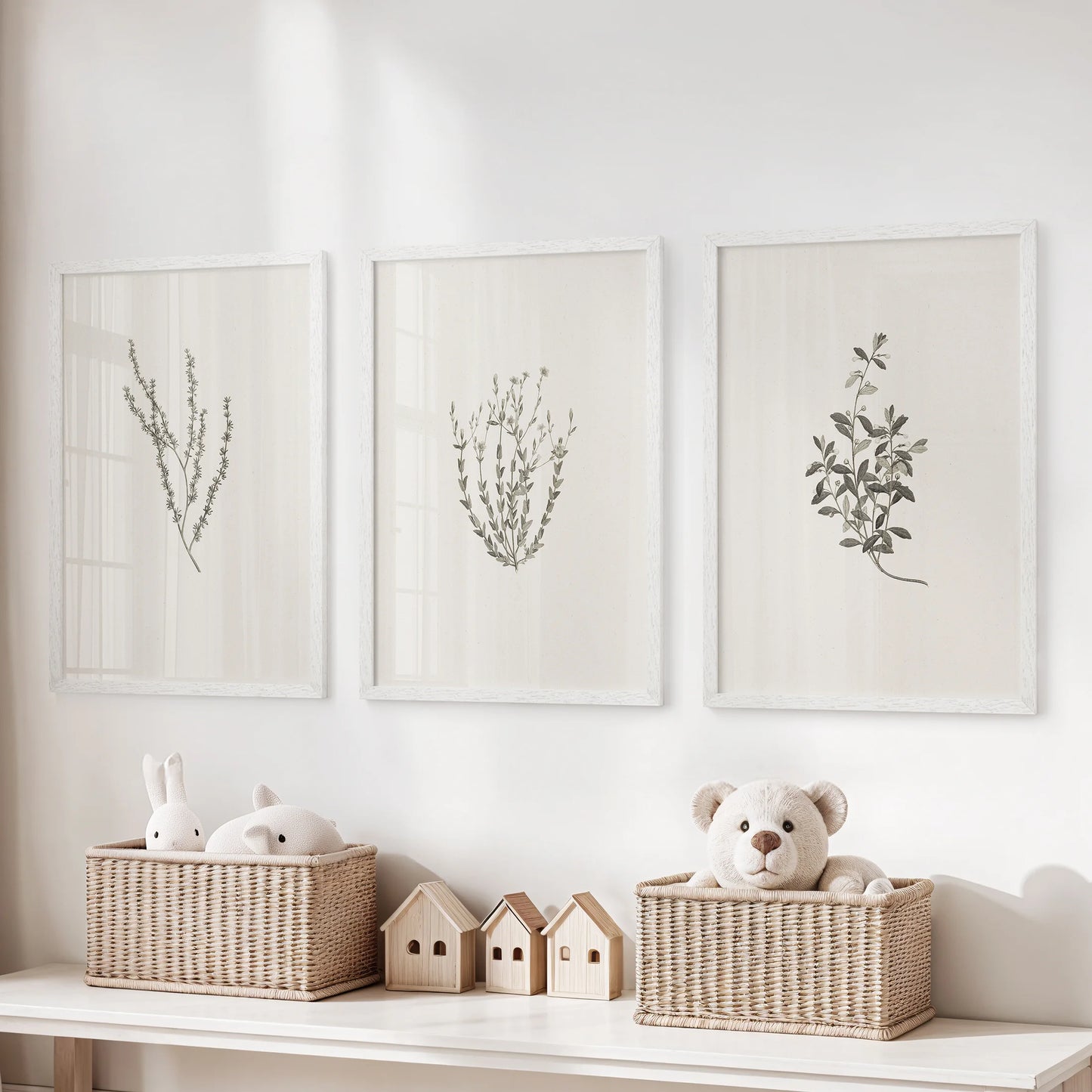 Cottagecore wildflower sprigs 3-piece wall hanging set, in white framed prints, hangs above toy storage in the playroom for a light, nostalgic touch.