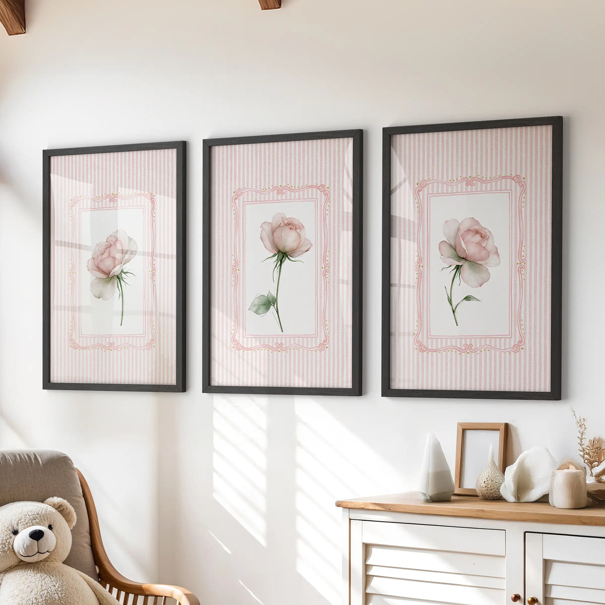 Vintage floral wall art, a three-piece set in black frames, is displayed above a dresser in a kids' playroom.